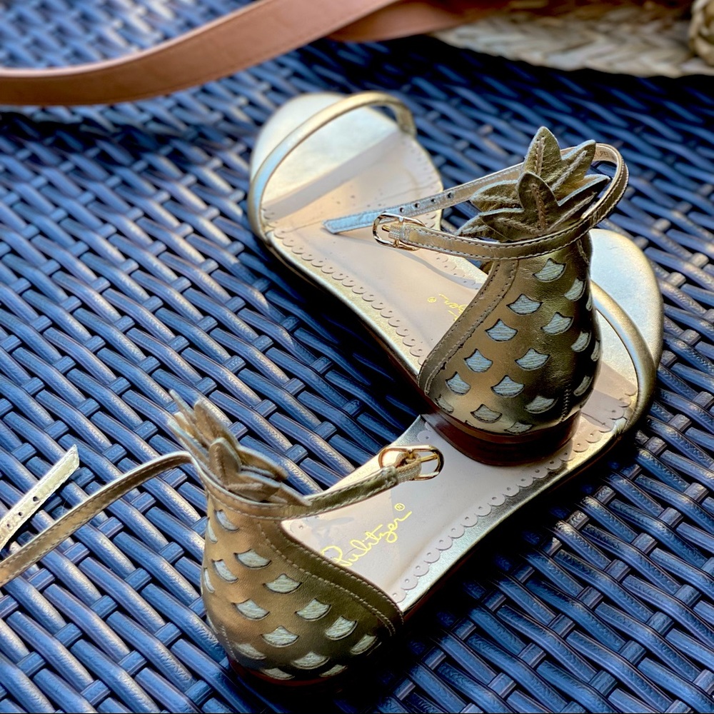 Lilly Pulitzer pineapple shoes. They are gold and have only been wore once.